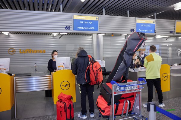 A traveler checks in at a Lufthansa counter