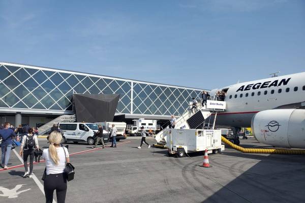 Passengers disembark an Aegean Airlines flight