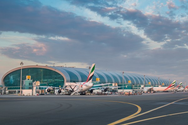 Emirates planes line the concourse at the Dubai Airport