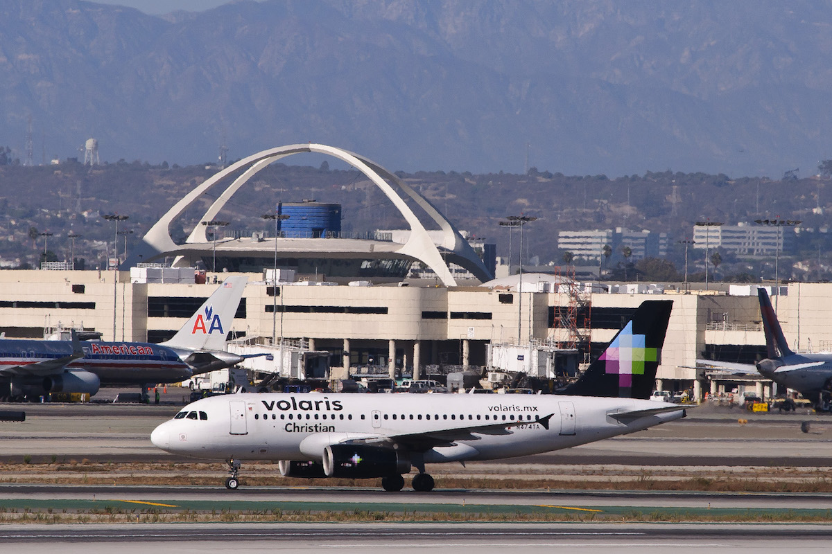 A Volaris plane taxis at LAX