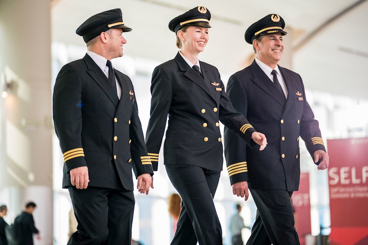 Three Delta pilots walking