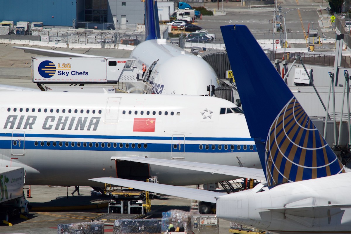 Air China, United, and Lufthansa jets at San Francisco airport.