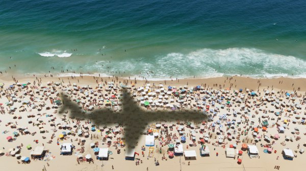 Airplane over beach in Rio.