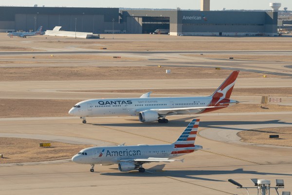 Qantas and American jets taxi in Dallas-Fort Worth