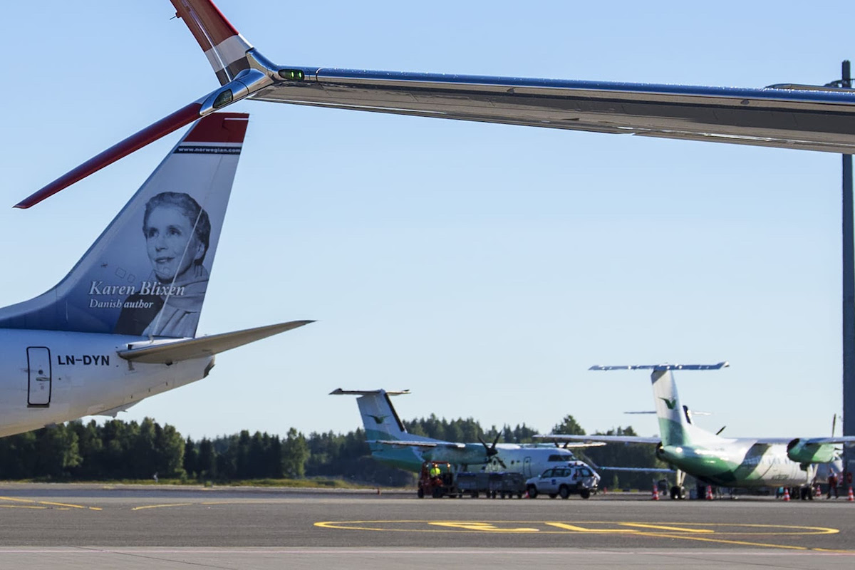 Norwegian Air and Wideroe aircraft at an airport