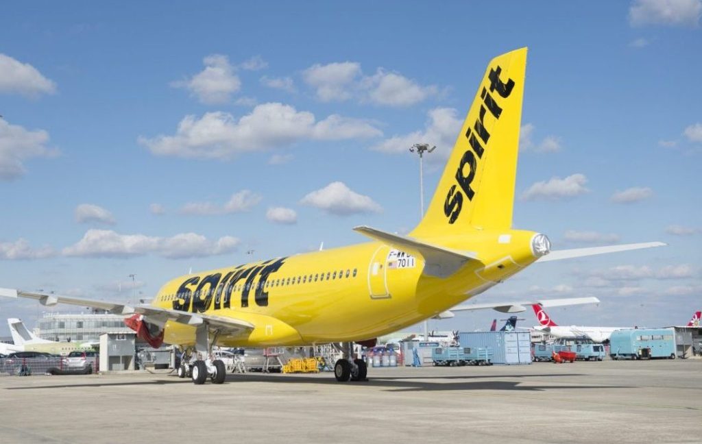 A Spirit Airlines Airbus A320neo parked at the airport.